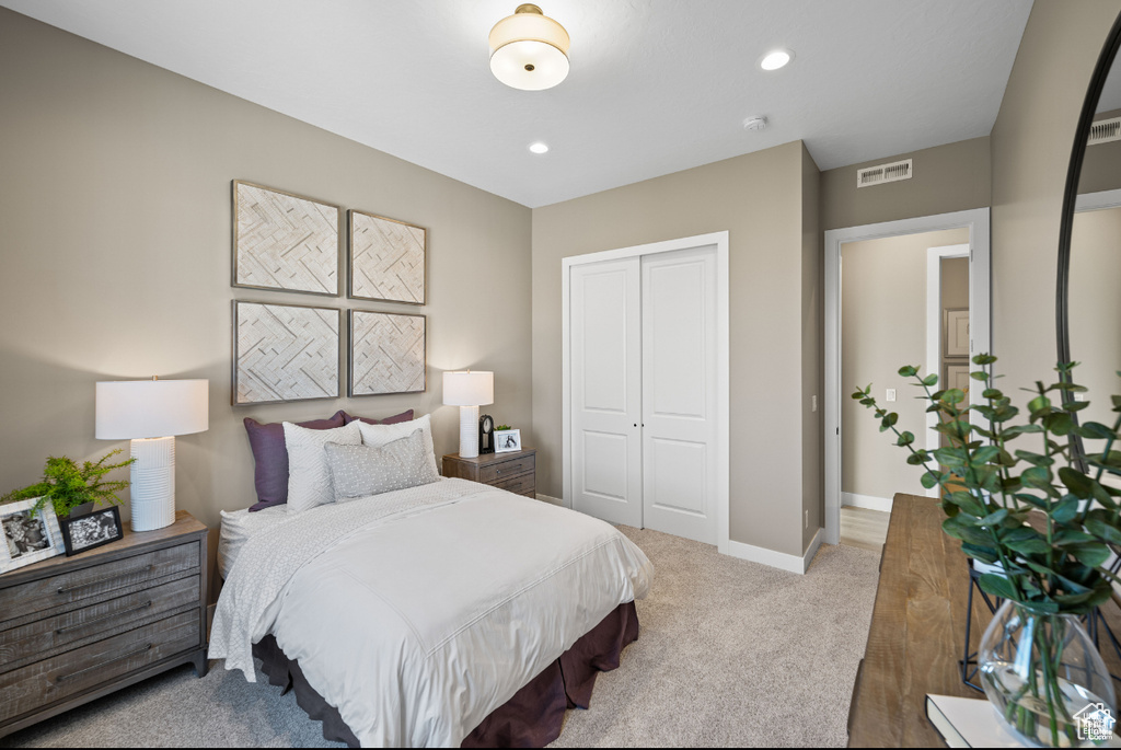 Bedroom featuring a closet, carpet, baseboards, and recessed lighting