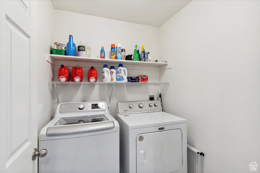 Laundry room with washing machine and clothes dryer