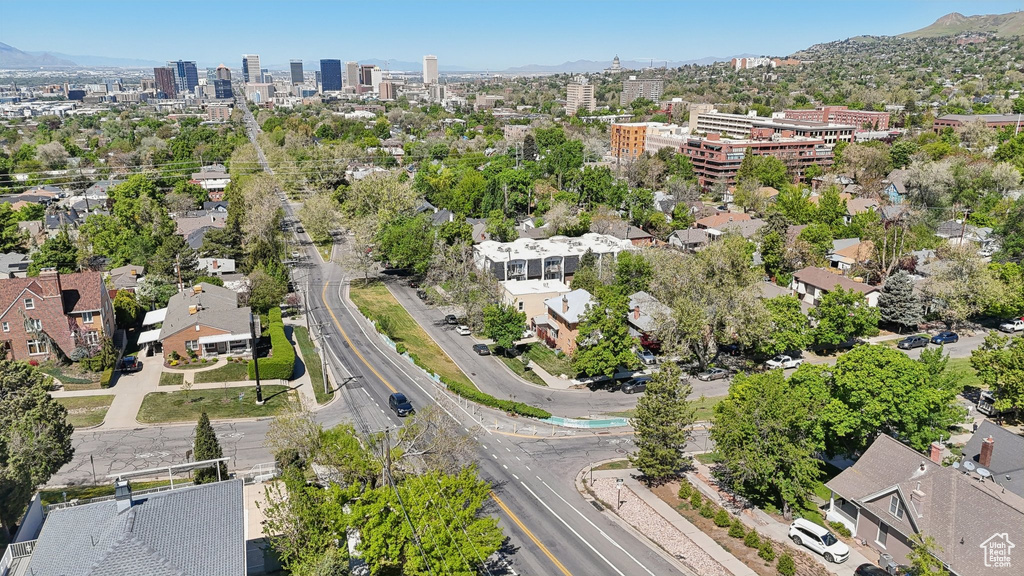 Aerial overview of property's location featuring nearby urban area and mountains