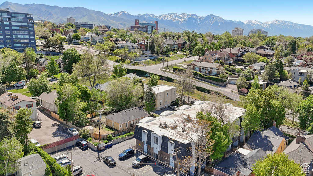 Aerial perspective of suburban area with a mountain backdrop
