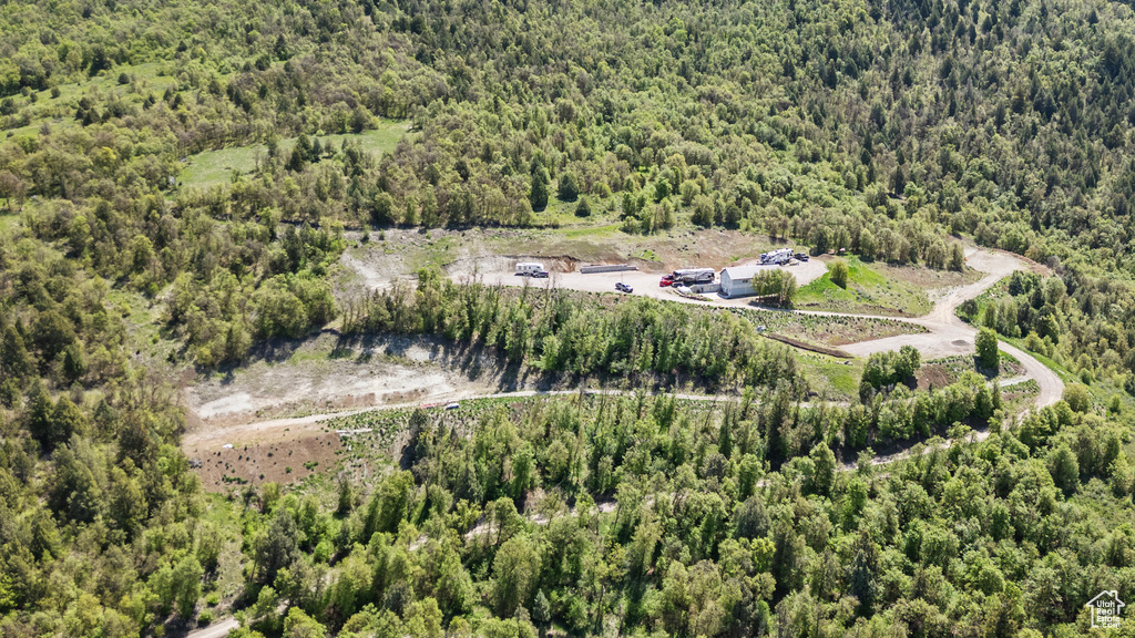 Aerial view of property\'s location featuring a forest