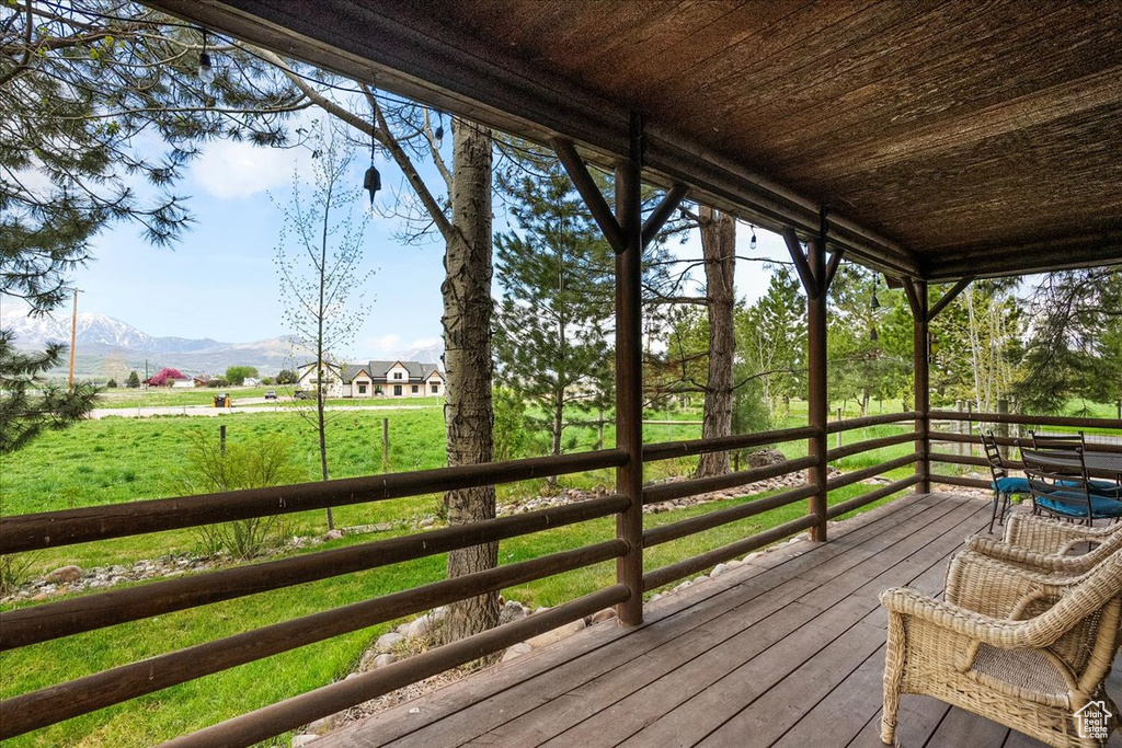 Wooden terrace featuring a mountain view