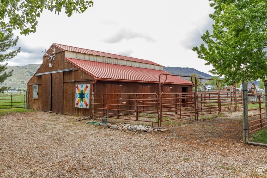 View of outdoor structure with an outbuilding, a mountain view, and an exterior structure