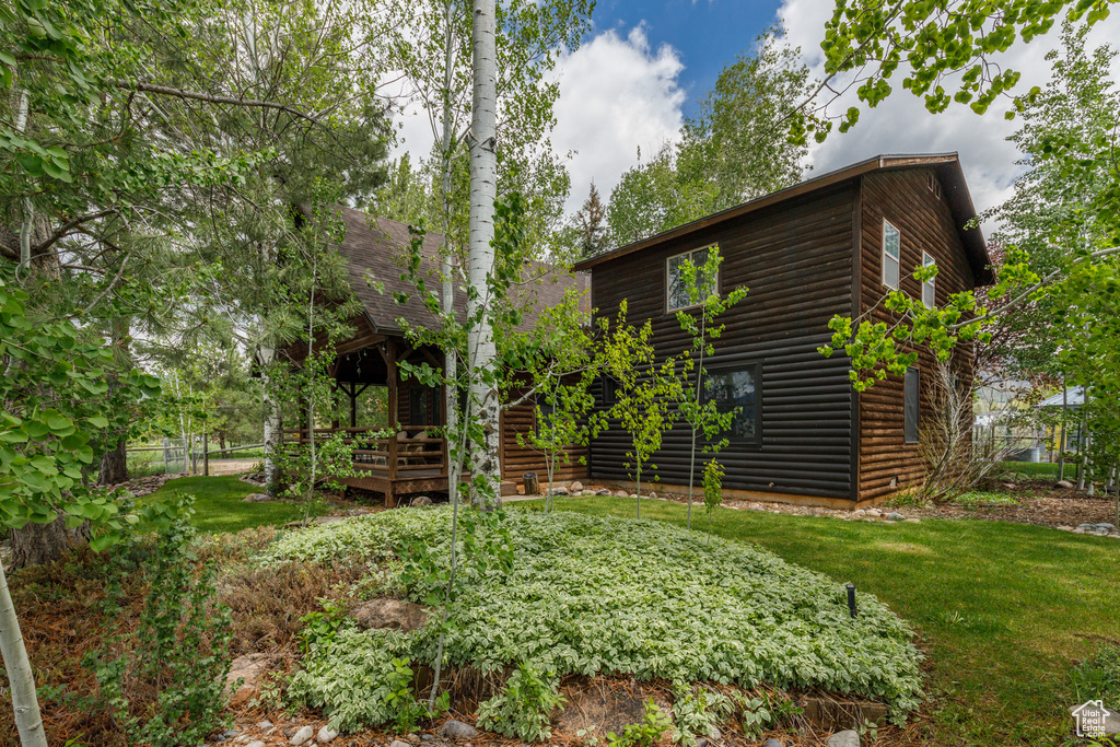 View of yard with a wooden deck