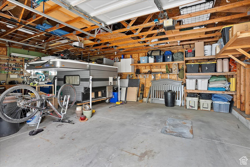 Garage featuring a garage door opener
