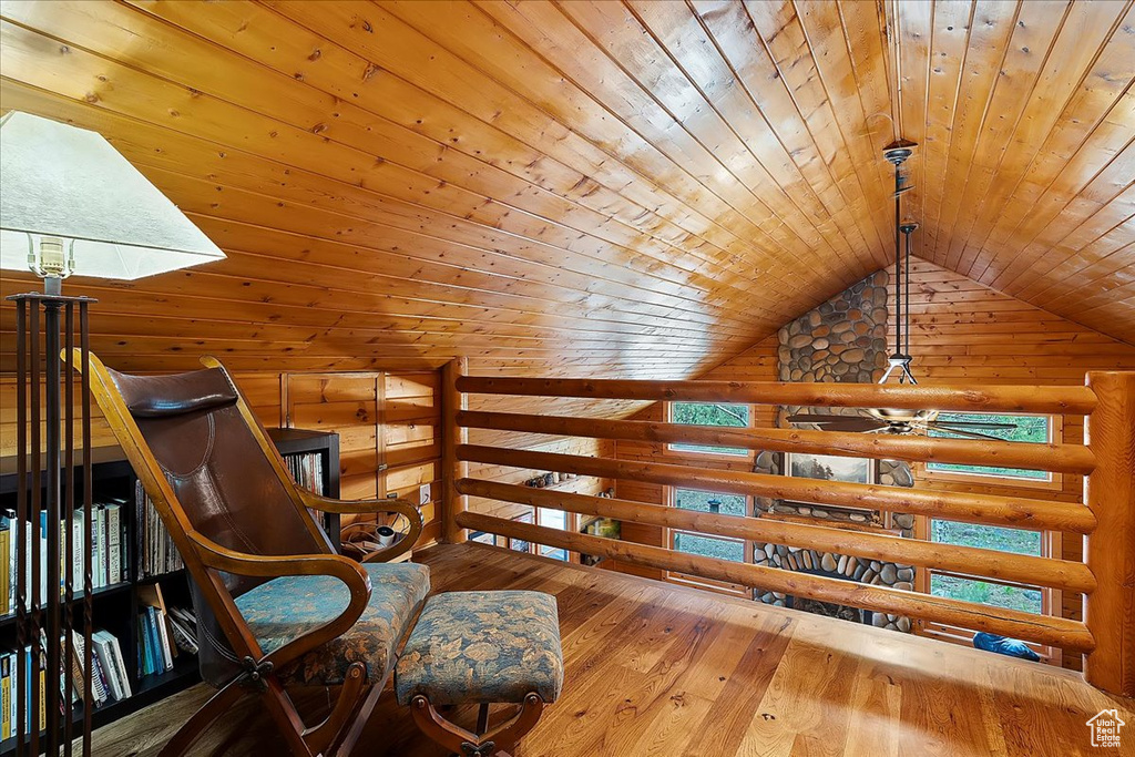 Living area featuring wood ceiling, lofted ceiling, and hardwood / wood-style flooring
