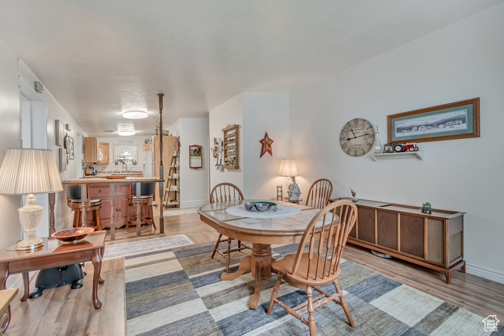 Dining room featuring baseboards and light wood-style floors