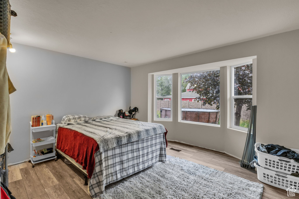 Bedroom with light wood-style floors