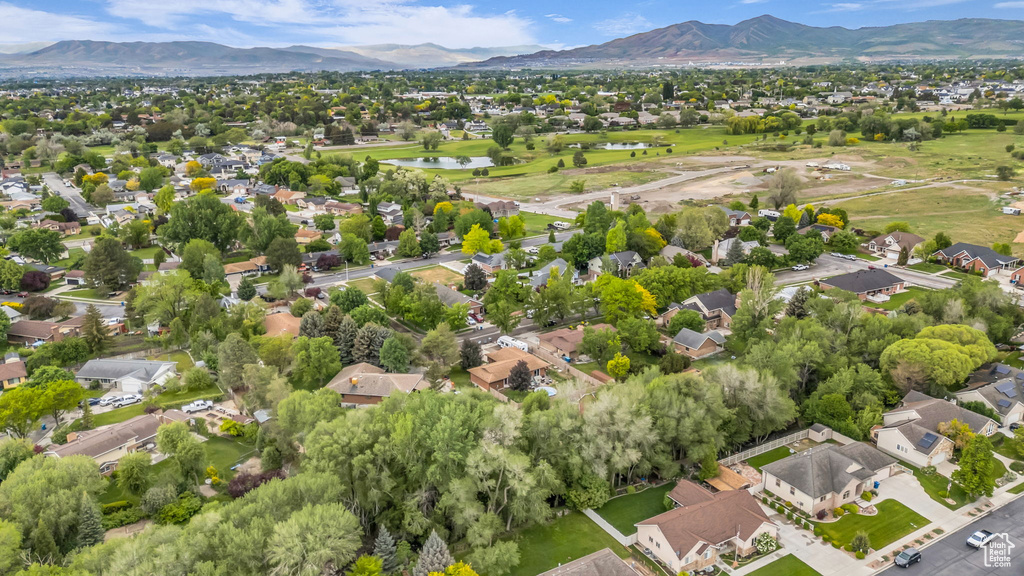 Aerial perspective of suburban area with a water and mountain view