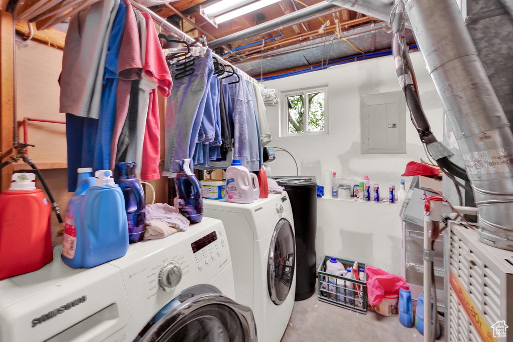 Washroom featuring washer and clothes dryer and electric panel