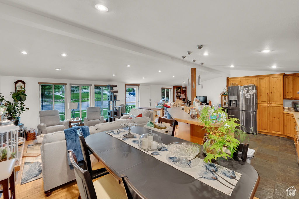 Dining area featuring recessed lighting and lofted ceiling