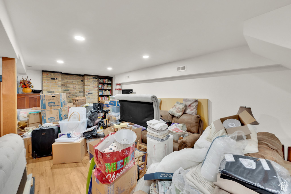 Living room with wood finished floors and recessed lighting