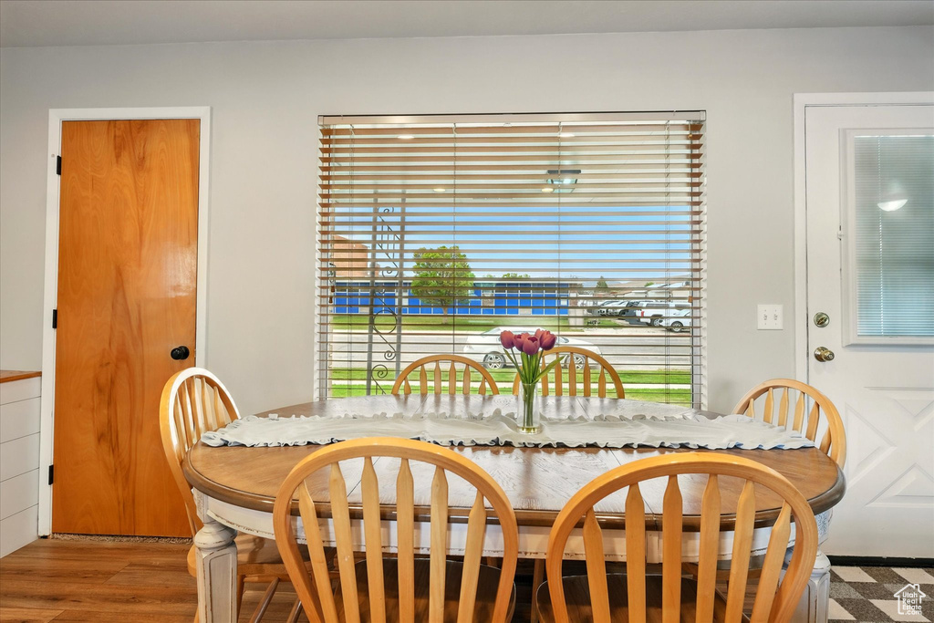Dining space featuring plenty of natural light and wood finished floors