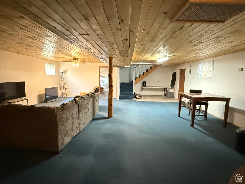 Below grade area featuring stairway and wood ceiling