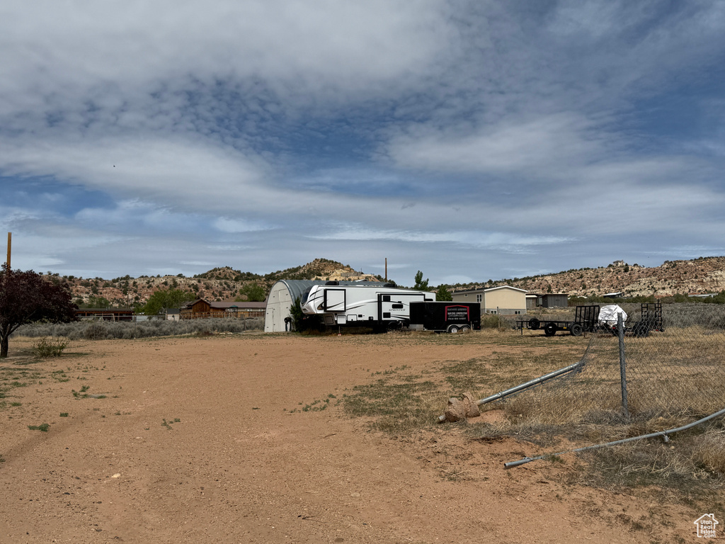 View of yard featuring an outbuilding and a storage shed