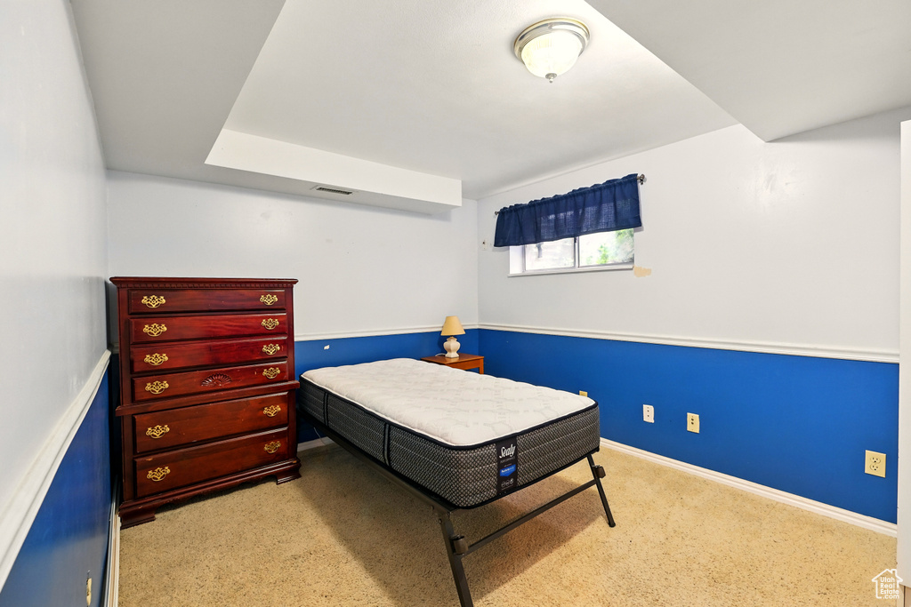 Carpeted bedroom with baseboards