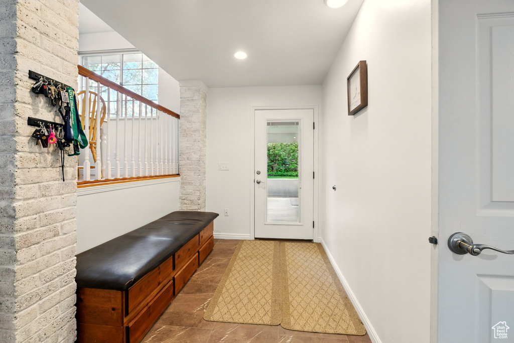Mudroom with healthy amount of natural light, baseboards, and recessed lighting