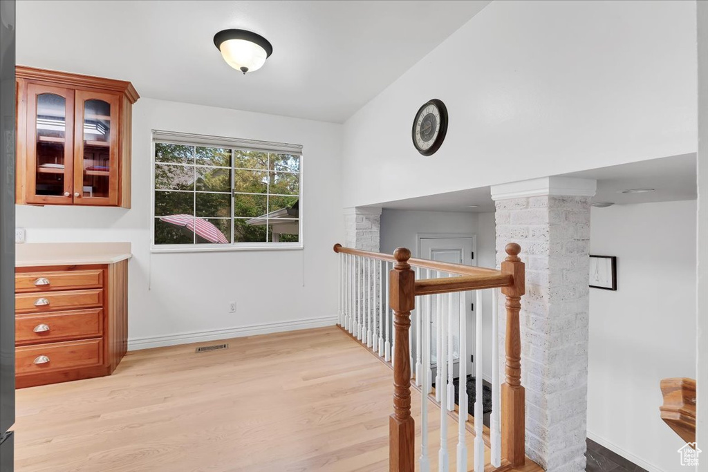 Hallway featuring light wood-style flooring
