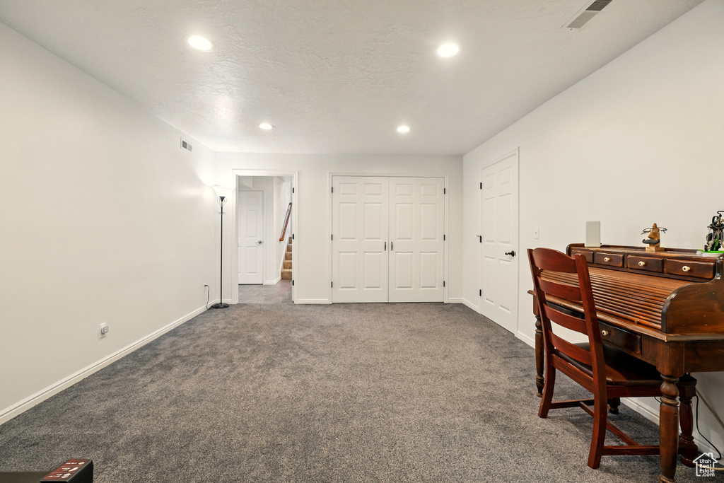Dining space with recessed lighting, dark carpet, and baseboards