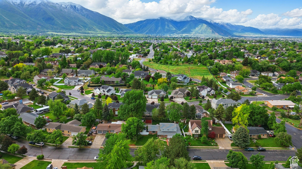 Aerial view of residential area featuring a mountain backdrop