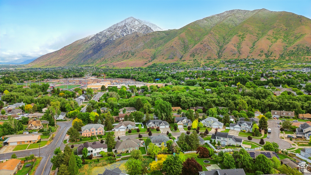 Aerial perspective of suburban area with a mountainous background