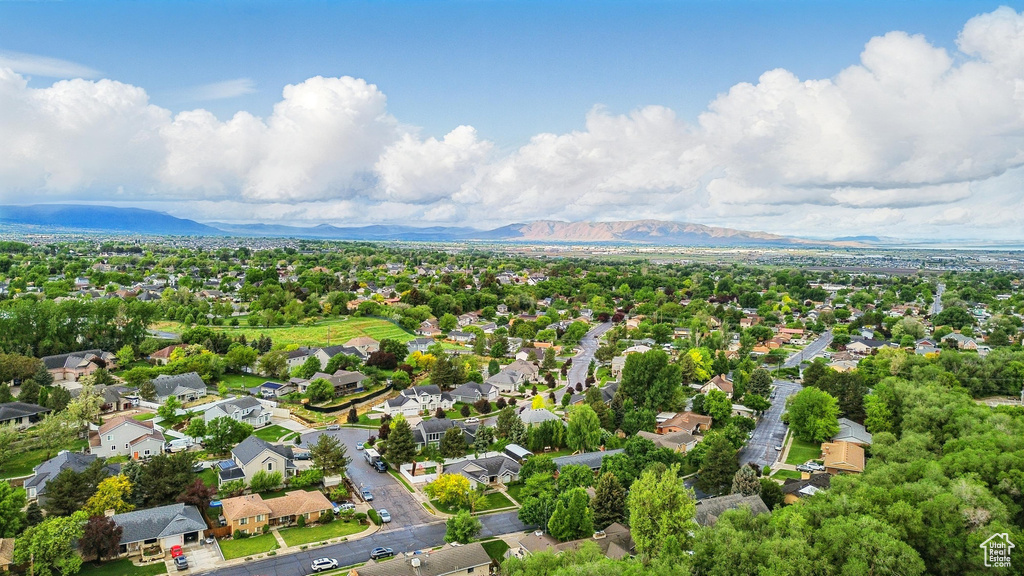 Aerial perspective of suburban area featuring a mountainous background