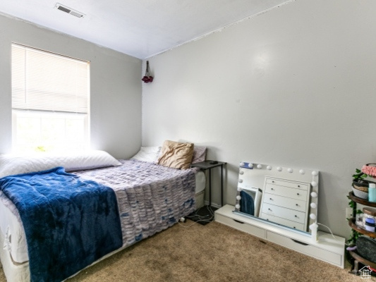 View of carpeted bedroom