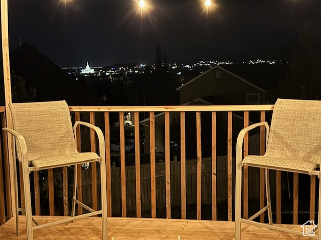 View of wooden balcony featuring a deck