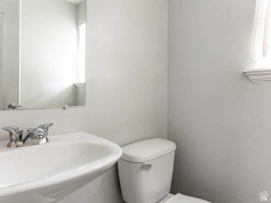 Bathroom featuring a sink and toilet
