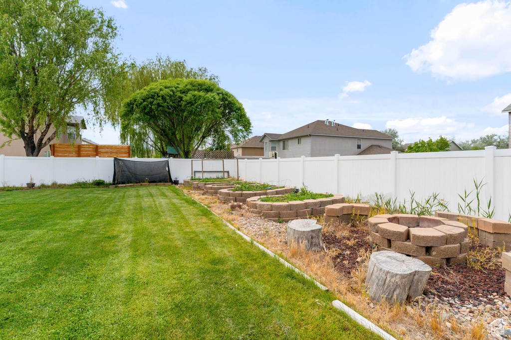 View of yard with an outdoor fire pit