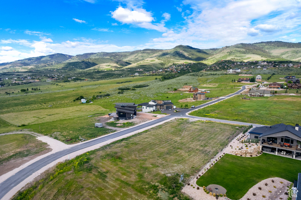 Overview of rural landscape featuring a mountainous background