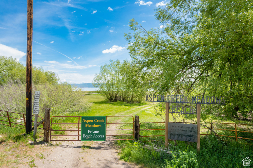 Gate with fence and a water view