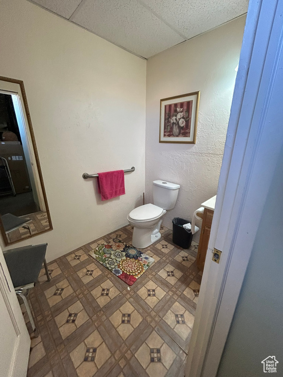 Half bathroom with toilet and vanity