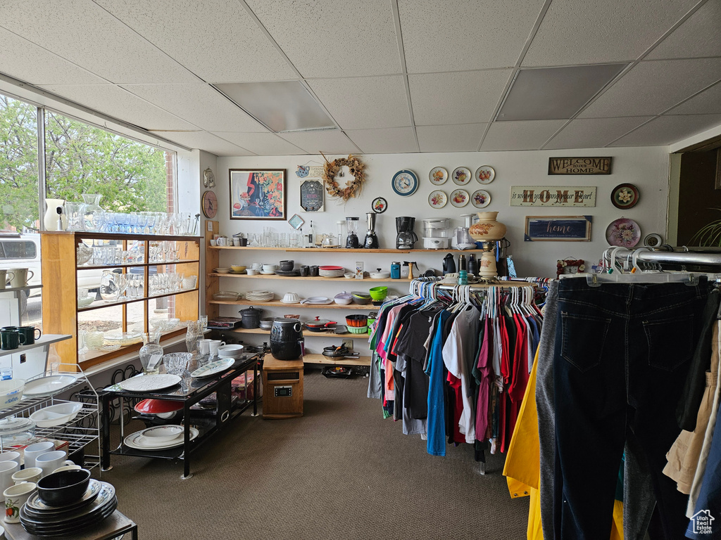 Miscellaneous room featuring a drop ceiling and carpet floors