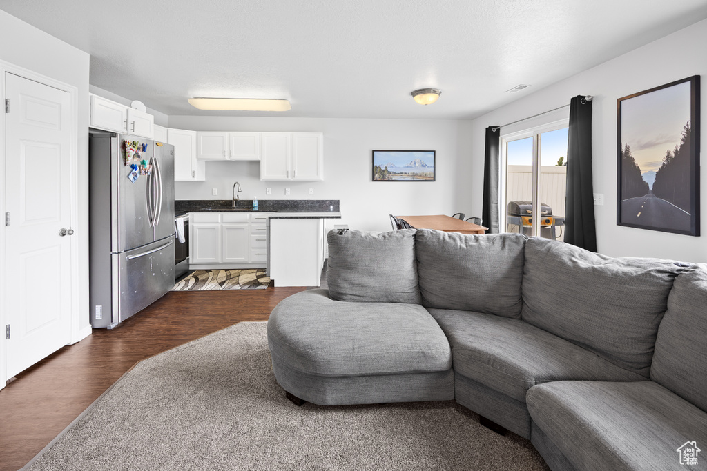 Living room featuring dark wood-style flooring