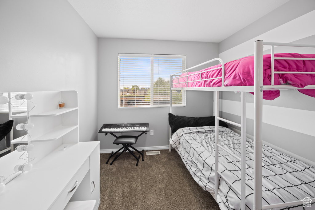 Carpeted bedroom with baseboards