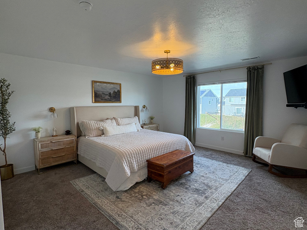 Bedroom with carpet and baseboards