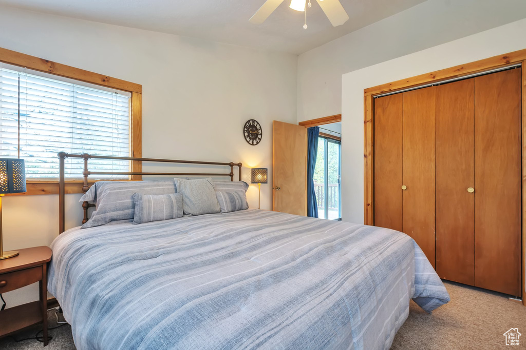 Bedroom featuring carpet, a closet, and ceiling fan
