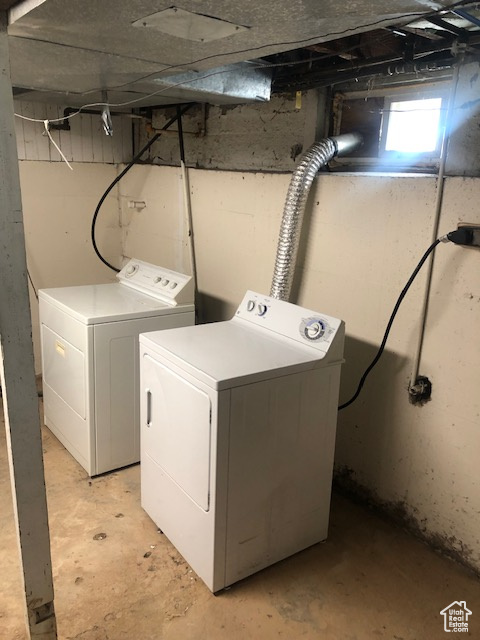 Laundry room with washing machine and dryer