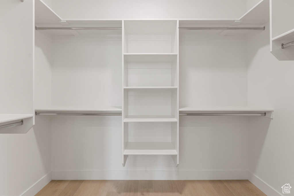Spacious closet featuring wood finished floors