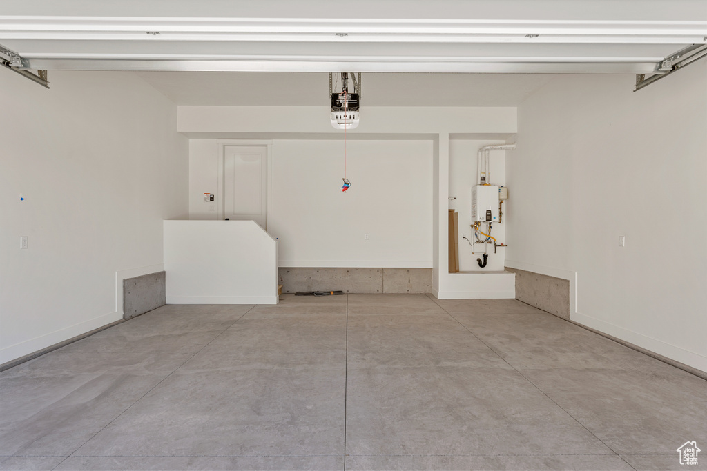 Garage with a garage door opener and water heater