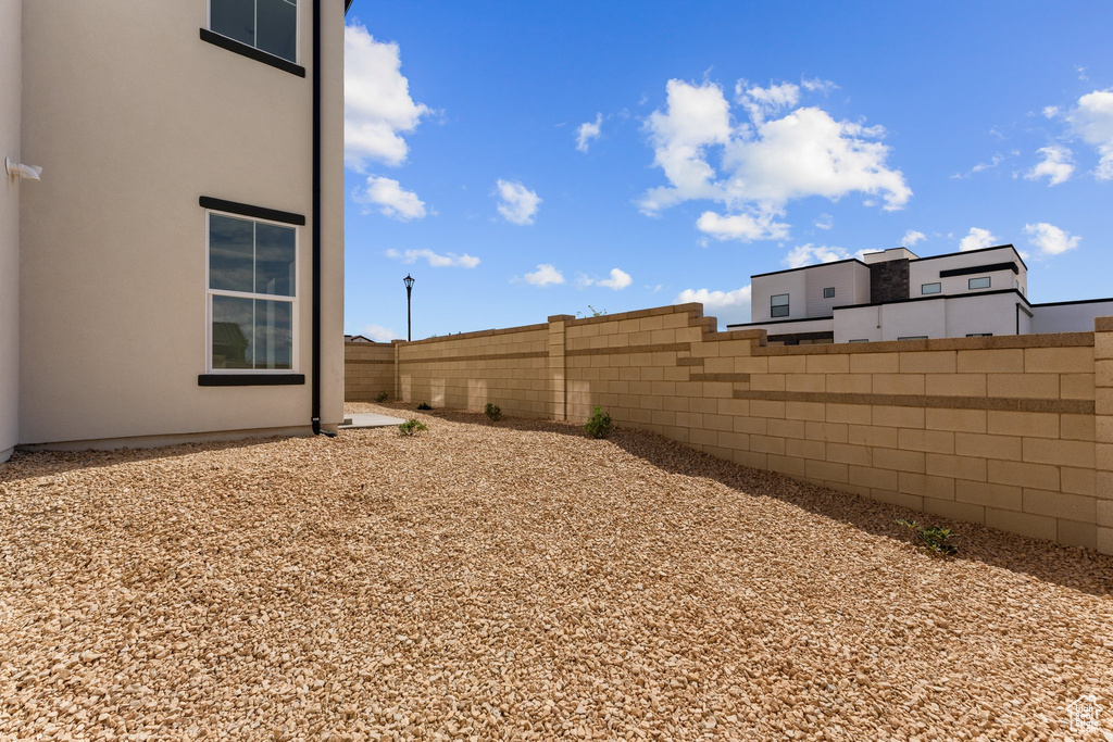 View of yard featuring fence