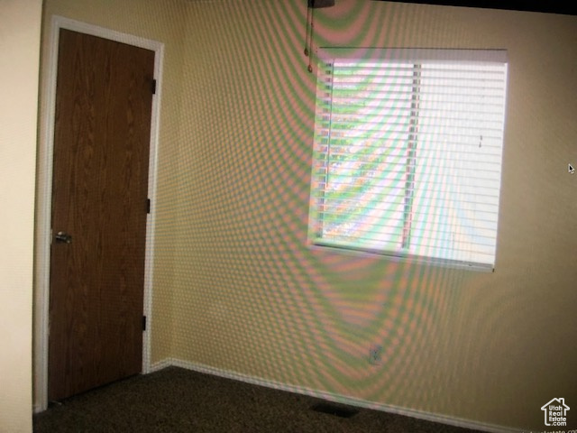 View of carpeted spare room