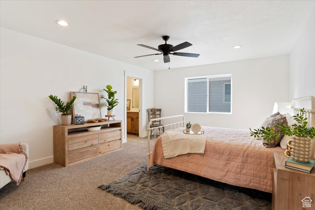 Carpeted bedroom with recessed lighting, a ceiling fan, and connected bathroom