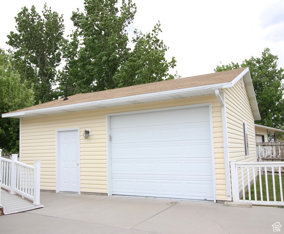 Detached garage with concrete driveway