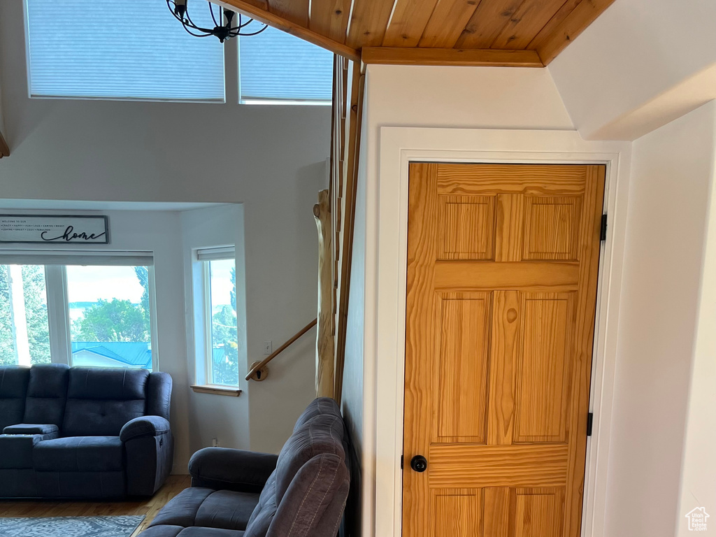 Living area featuring wood finished floors and lofted ceiling