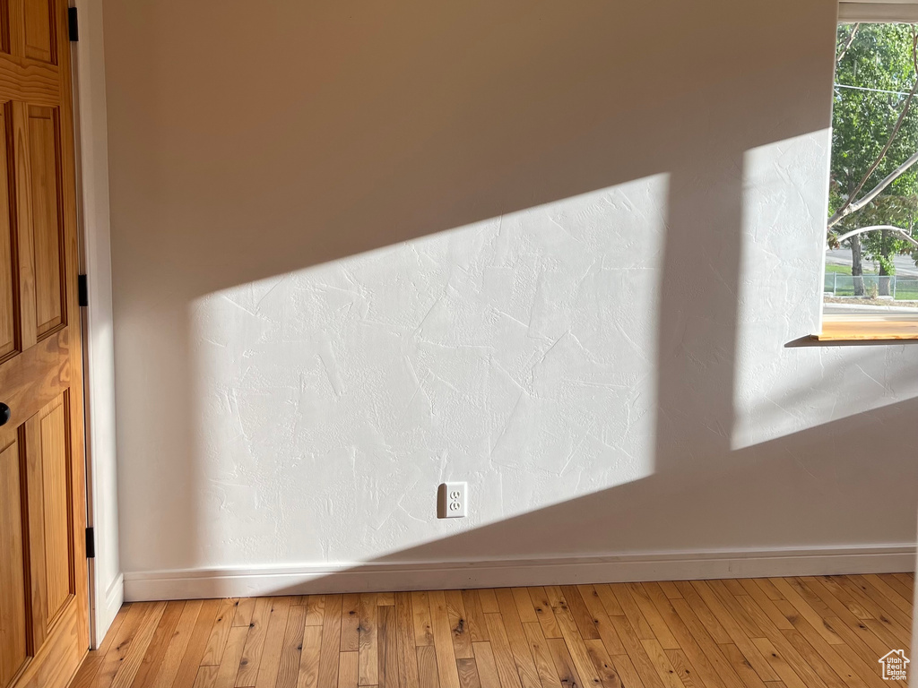 Detailed view of wood finished floors and baseboards