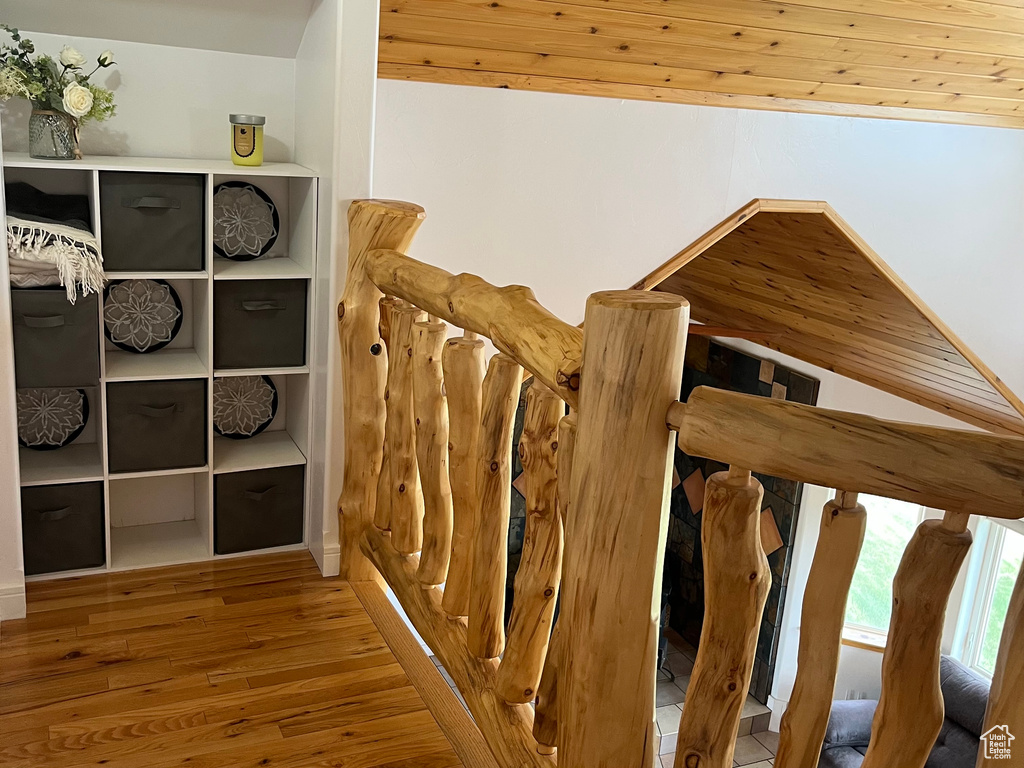 Staircase featuring wood finished floors