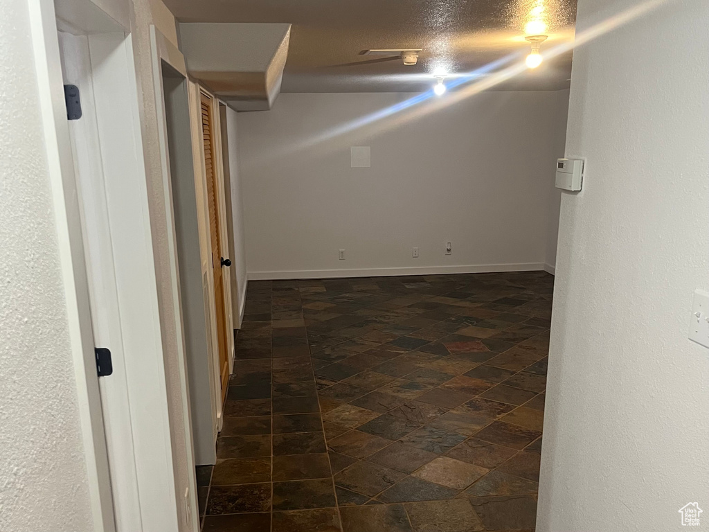 Corridor featuring baseboards