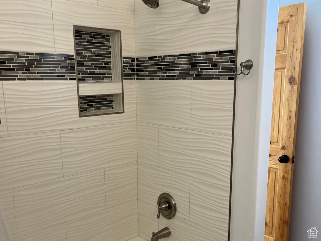 Bathroom view of tub / shower combination